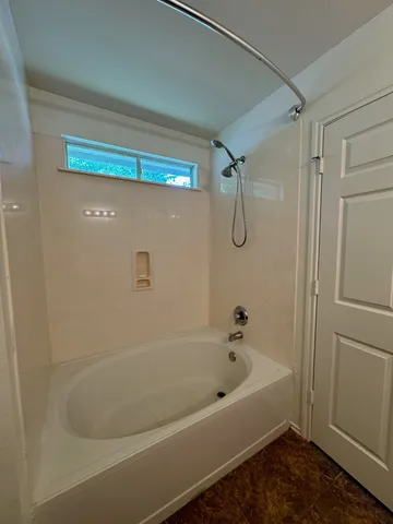 a bathroom with a bath tub