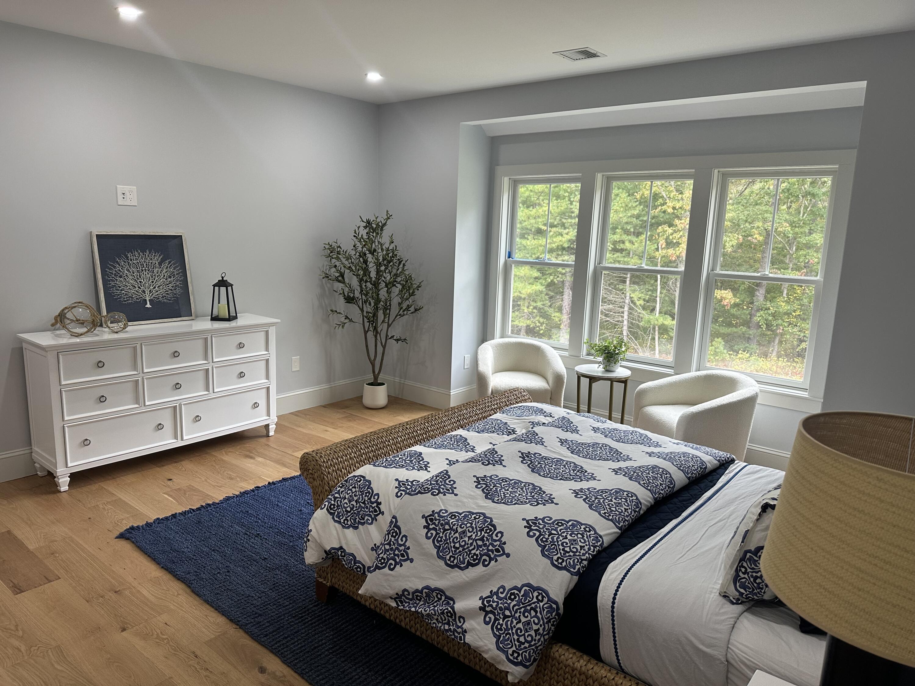 84 Hooppole Road Mashpee, MA 02649 - Photo 24 of 54 a bedroom with a bed and wooden floor