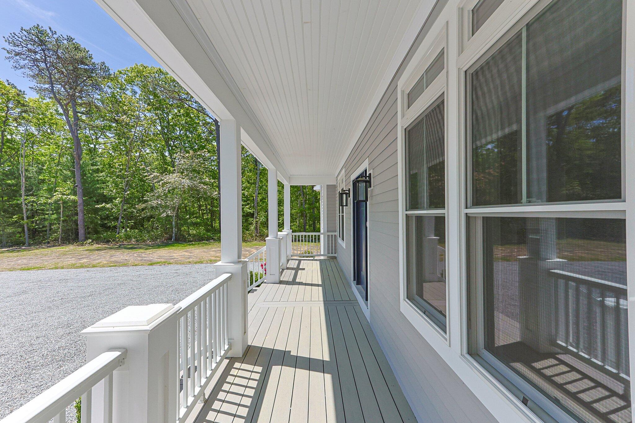 84 Hooppole Road Mashpee, MA 02649 - Photo 6 of 54 a view of balcony with floor to ceiling window and wooden floor