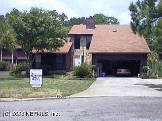 4292 Heath Road Jacksonville, FL 32277 - Photo 1 of 1 a front view of a house with a yard