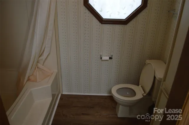 a bathroom with a toilet and a sink