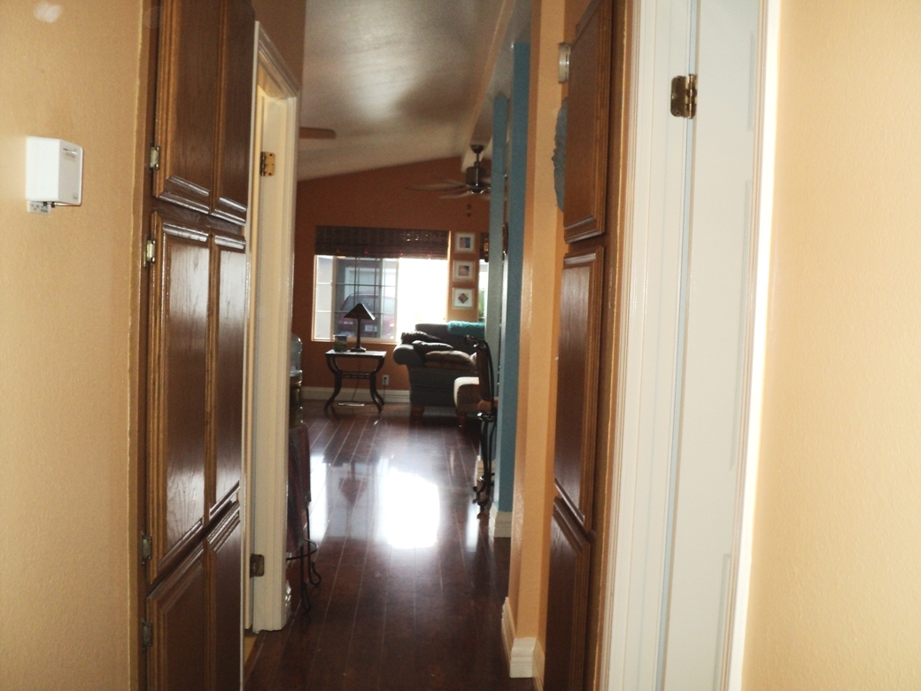 15935 Spring Oaks Road, Unit 112 El Cajon, CA 92021 - Photo 7 of 24 This perspective of the living room -- seen from the central hallway -- shows the beautiful sheen of the wood flooring.