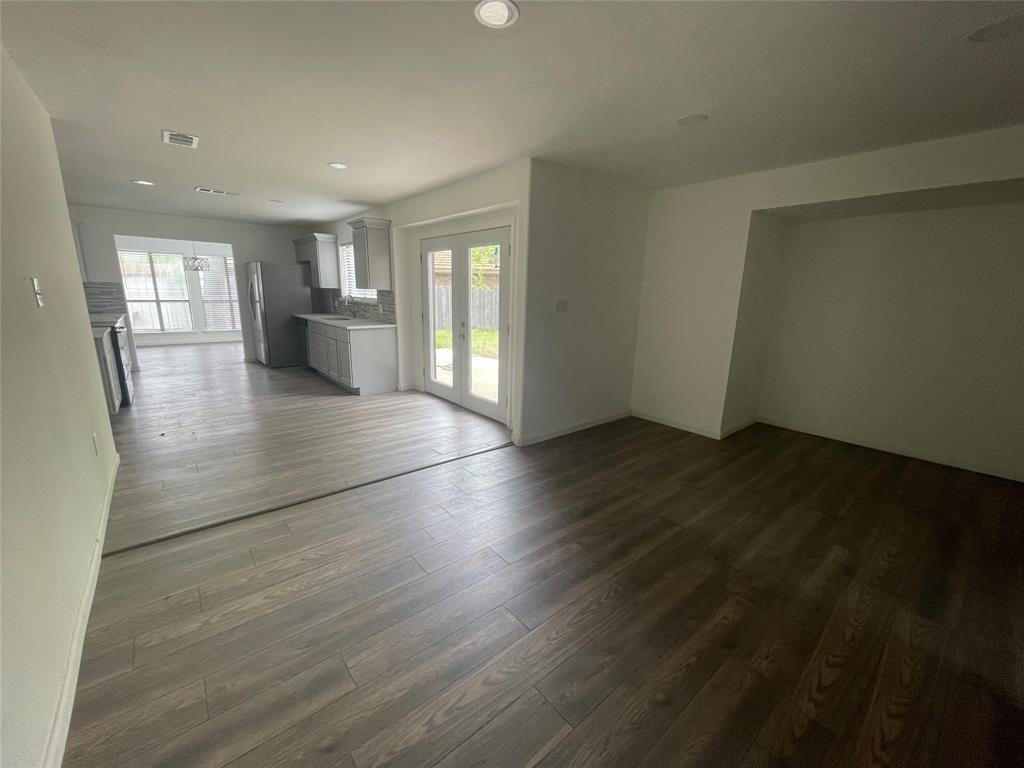 3 Ridge Drive Hickory Creek, TX 75065 - Photo 12 of 20 an empty room with wooden floor and windows