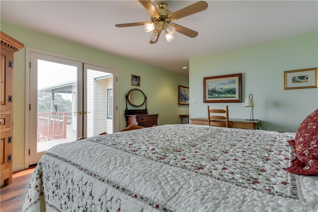 7250 Rancho Verano Place Paso Robles, CA 93446 - Photo 16 of 49 a bedroom with a large bed and a dresser
