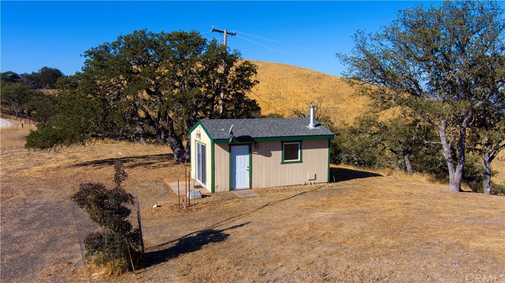 7250 Rancho Verano Place Paso Robles, CA 93446 - Photo 31 of 49 a view of a house with a yard