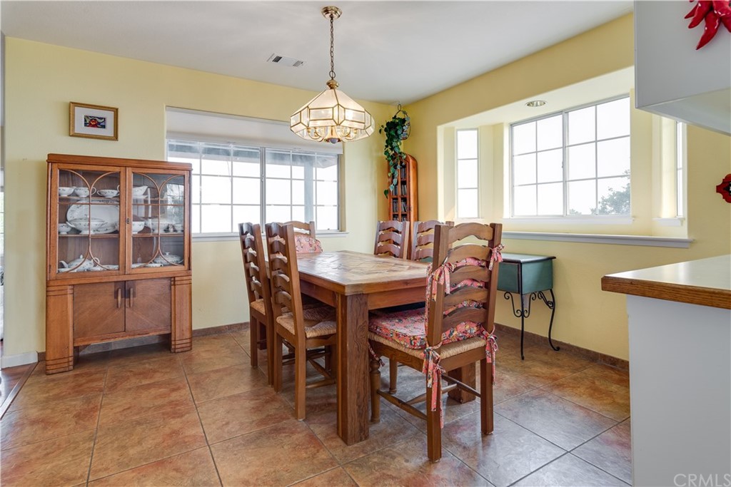 7250 Rancho Verano Place Paso Robles, CA 93446 - Photo 9 of 49 a view of a dining room with furniture window and outside view