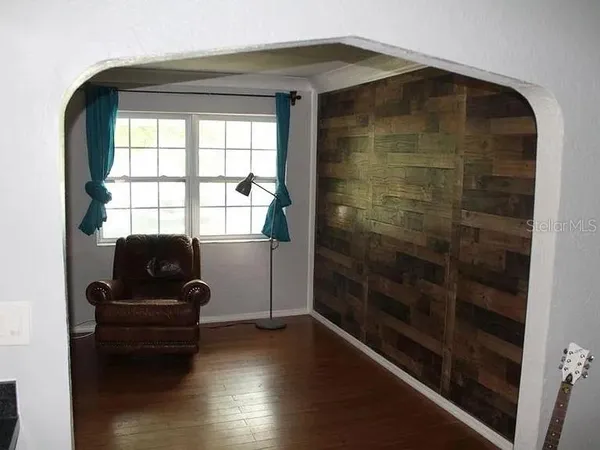 a living room with furniture and a window