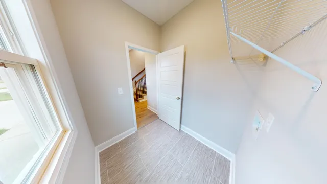 a view of front door and wooden floor