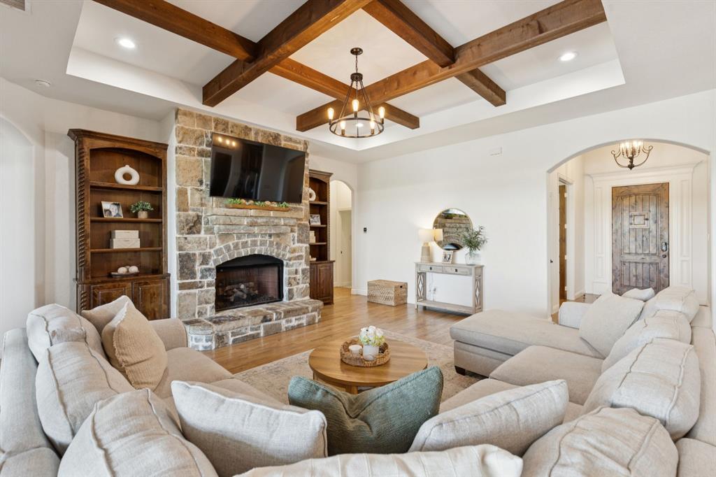 6824 Katie Corral Drive Fort Worth, TX 76126 - Photo 12 of 39 a living room with furniture a fireplace and a flat screen tv