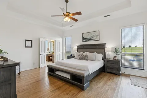 a bedroom with a bed and a view of closet