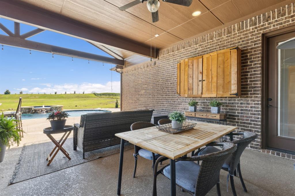 6824 Katie Corral Drive Fort Worth, TX 76126 - Photo 29 of 39 a view of a patio with table and chairs and potted plants