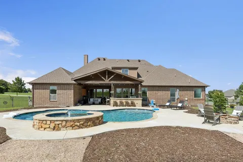 a front view of a house with yard