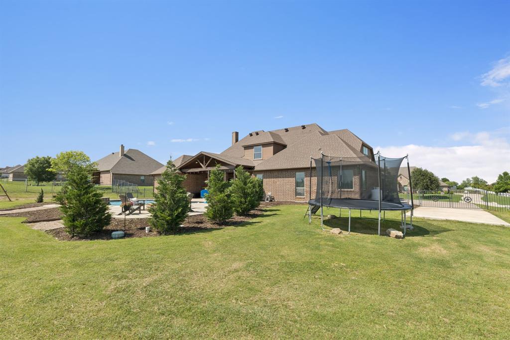 6824 Katie Corral Drive Fort Worth, TX 76126 - Photo 38 of 39 a view of a house with a yard and sitting area