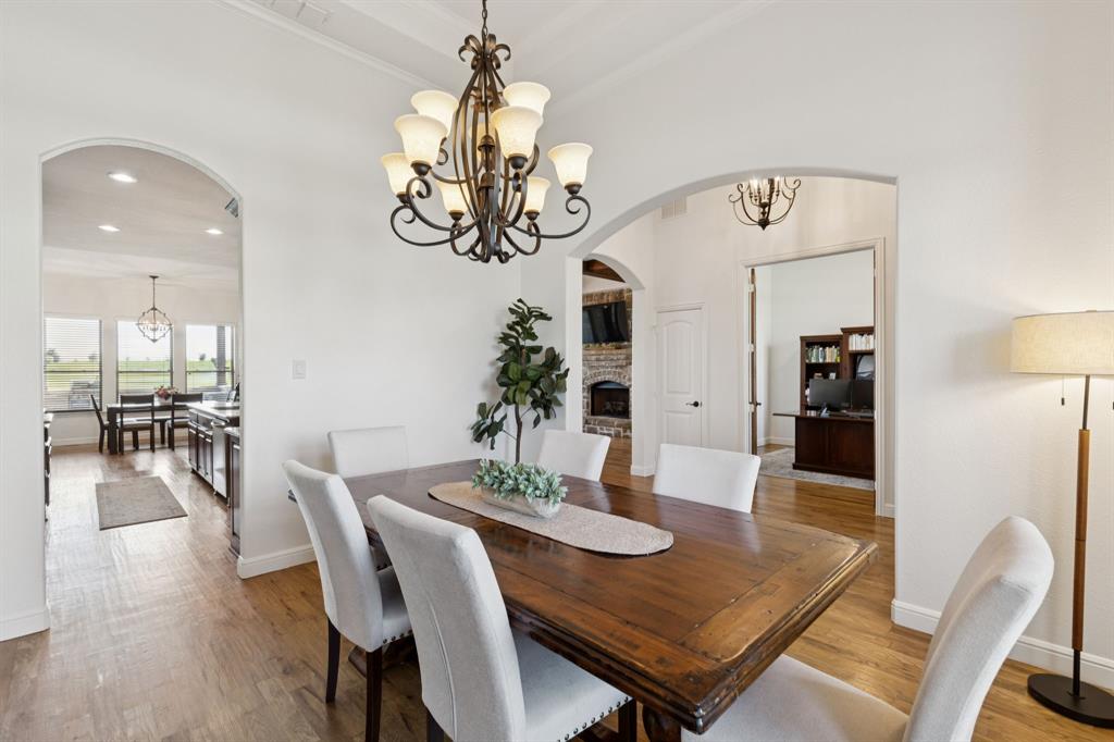 6824 Katie Corral Drive Fort Worth, TX 76126 - Photo 5 of 39 a view of a dining room with furniture wooden floor and chandelier