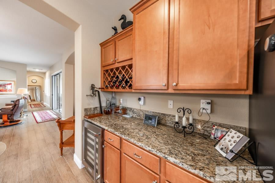 2210 Trakehner Lane Reno, NV 89521 - Photo 14 of 39 a kitchen with sink refrigerator and cabinets