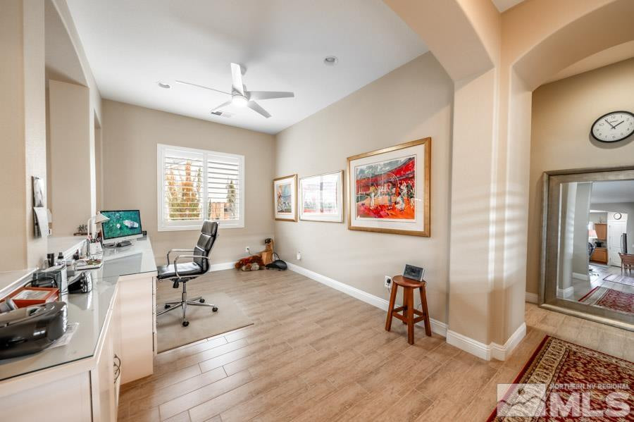 2210 Trakehner Lane Reno, NV 89521 - Photo 15 of 39 a view of a livingroom with workspace and a window