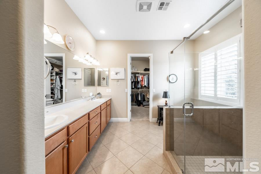 2210 Trakehner Lane Reno, NV 89521 - Photo 19 of 39 a large bathroom with a large tub and sink