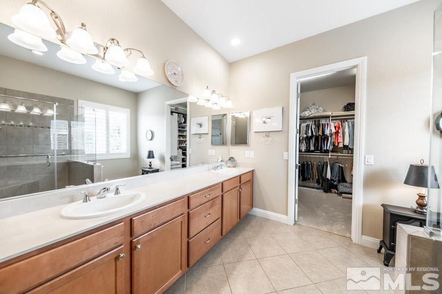 2210 Trakehner Lane Reno, NV 89521 - Photo 20 of 39 a spacious bathroom with a sink double vanity and mirror
