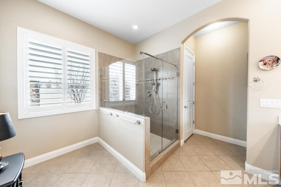 2210 Trakehner Lane Reno, NV 89521 - Photo 21 of 39 a bathroom with a tub shower and sink