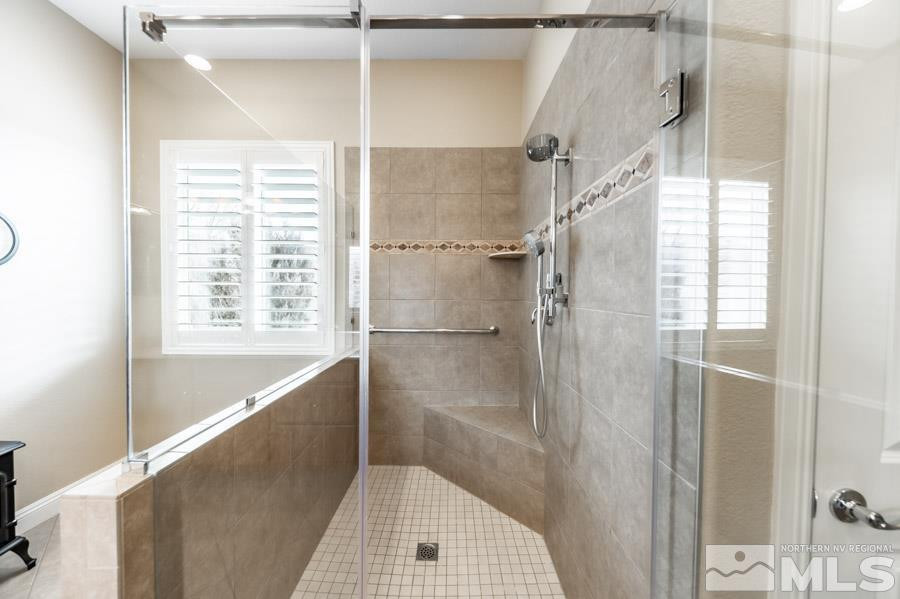 2210 Trakehner Lane Reno, NV 89521 - Photo 22 of 39 a bathroom with a shower and a window