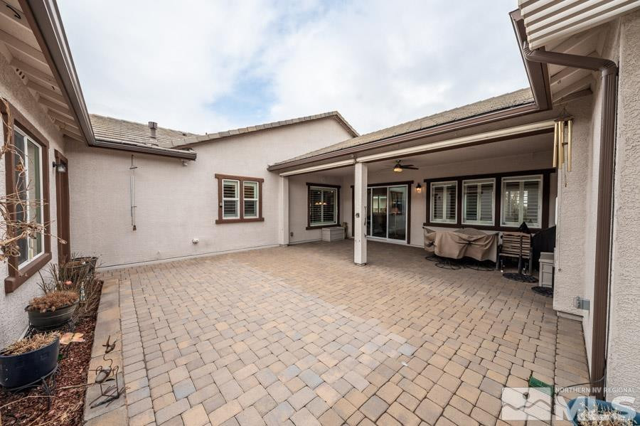 2210 Trakehner Lane Reno, NV 89521 - Photo 29 of 39 a view of a house with a backyard and a chair
