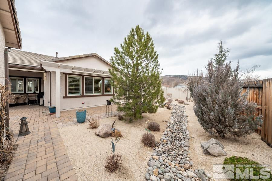 2210 Trakehner Lane Reno, NV 89521 - Photo 30 of 39 a view of a house with a yard and sitting area