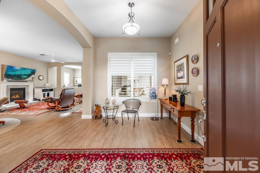 2210 Trakehner Lane Reno, NV 89521 - Photo 3 of 39 a living room with furniture and a wooden floor
