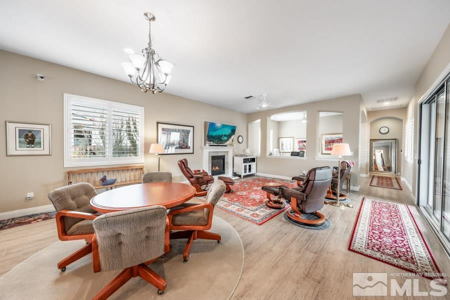 2210 Trakehner Lane Reno, NV 89521 - Photo 6 of 39 a living room with furniture a chandelier and a window