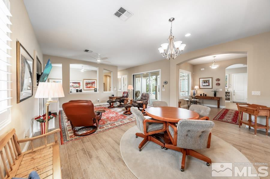 2210 Trakehner Lane Reno, NV 89521 - Photo 9 of 39 a living room with furniture and a chandelier