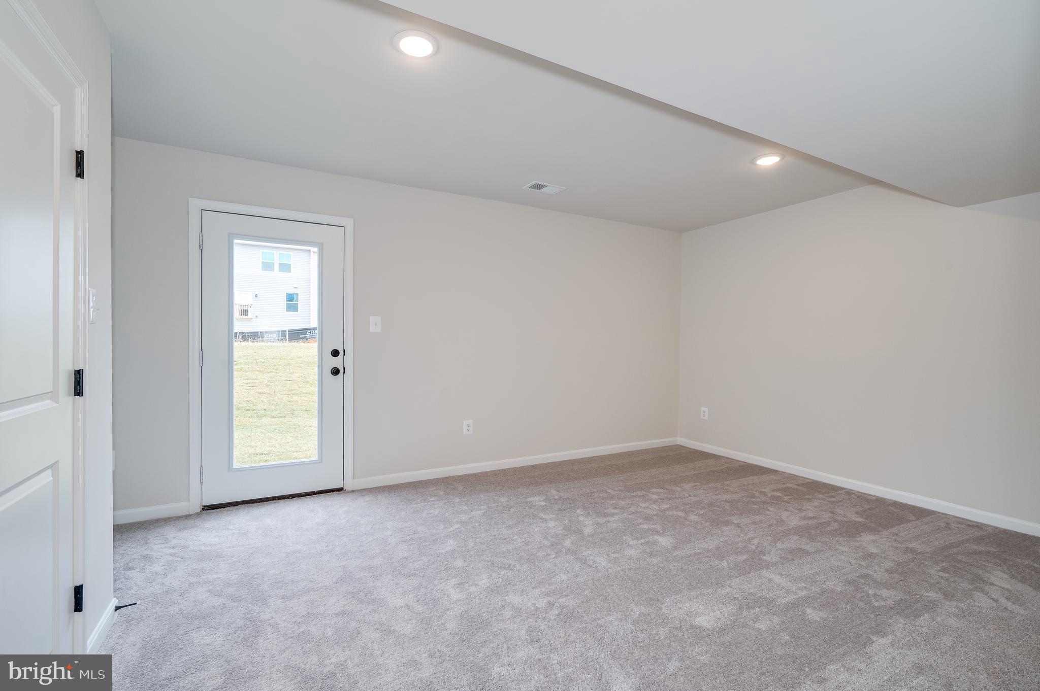 164 Rabbit Road Hedgesville, WV 25427 - Photo 18 of 41 a view of an empty room with a window