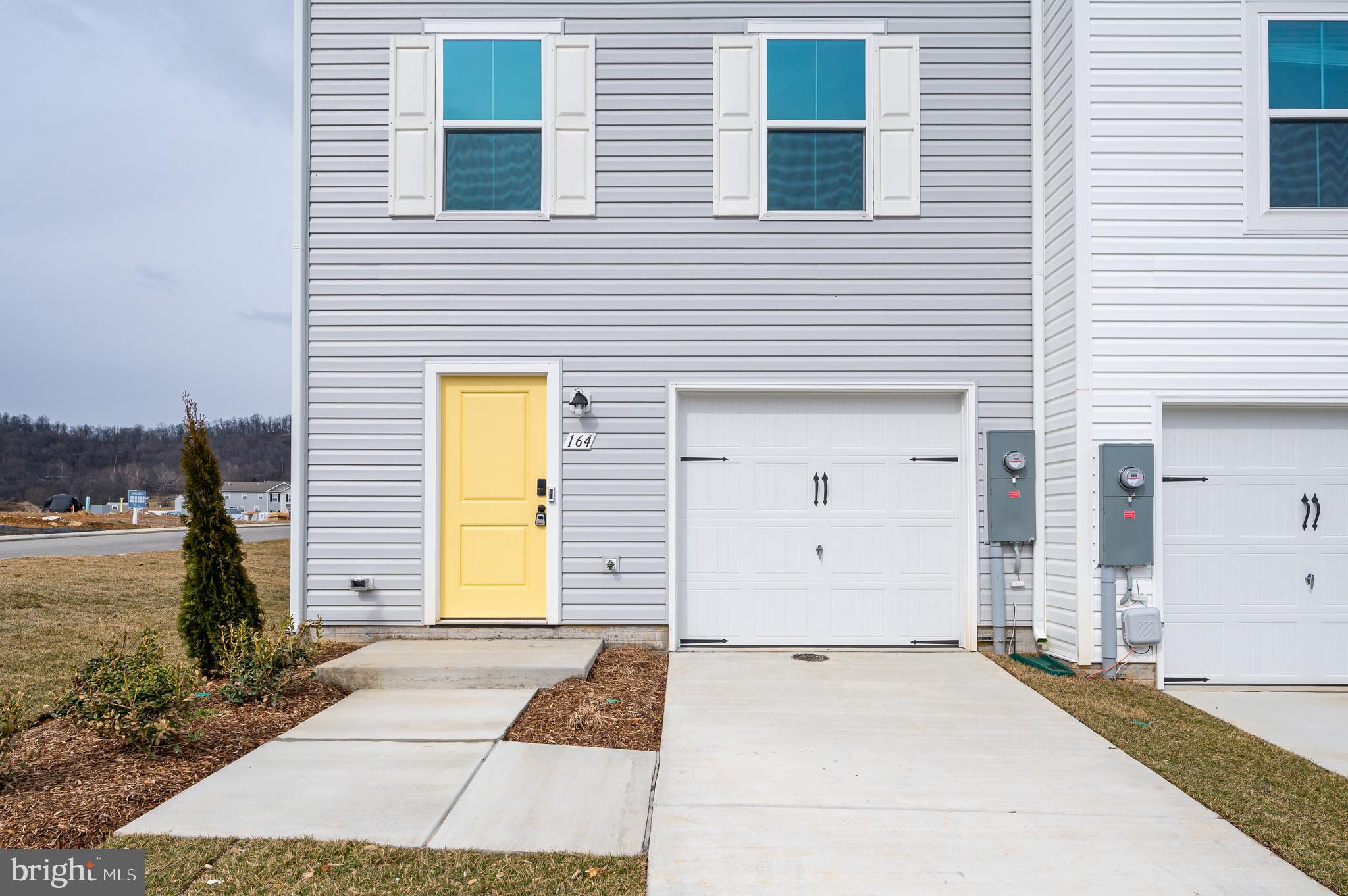 164 Rabbit Road Hedgesville, WV 25427 - Photo 7 of 41 a view of a brick house with many windows