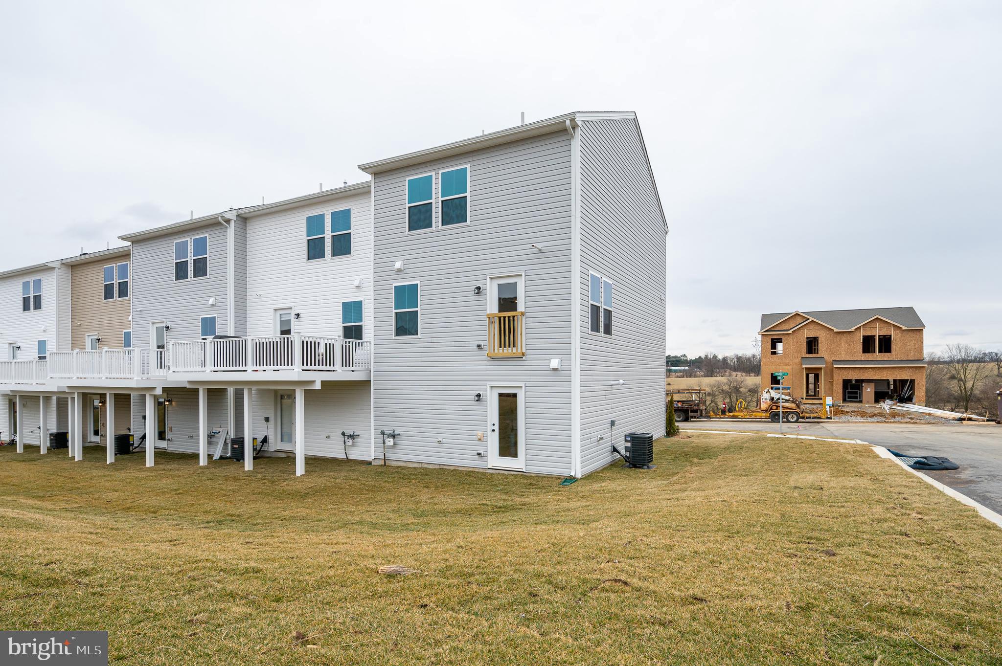 164 Rabbit Road Hedgesville, WV 25427 - Photo 10 of 41 a front view of a house with a yard and balcony