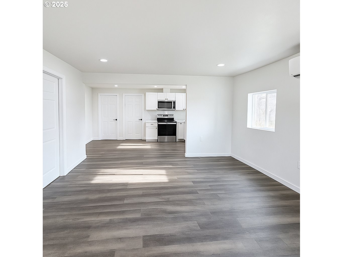 310 4th Street Northeast Irrigon, OR 97844 - Photo 6 of 13 a view of kitchen and empty room with wooden floor