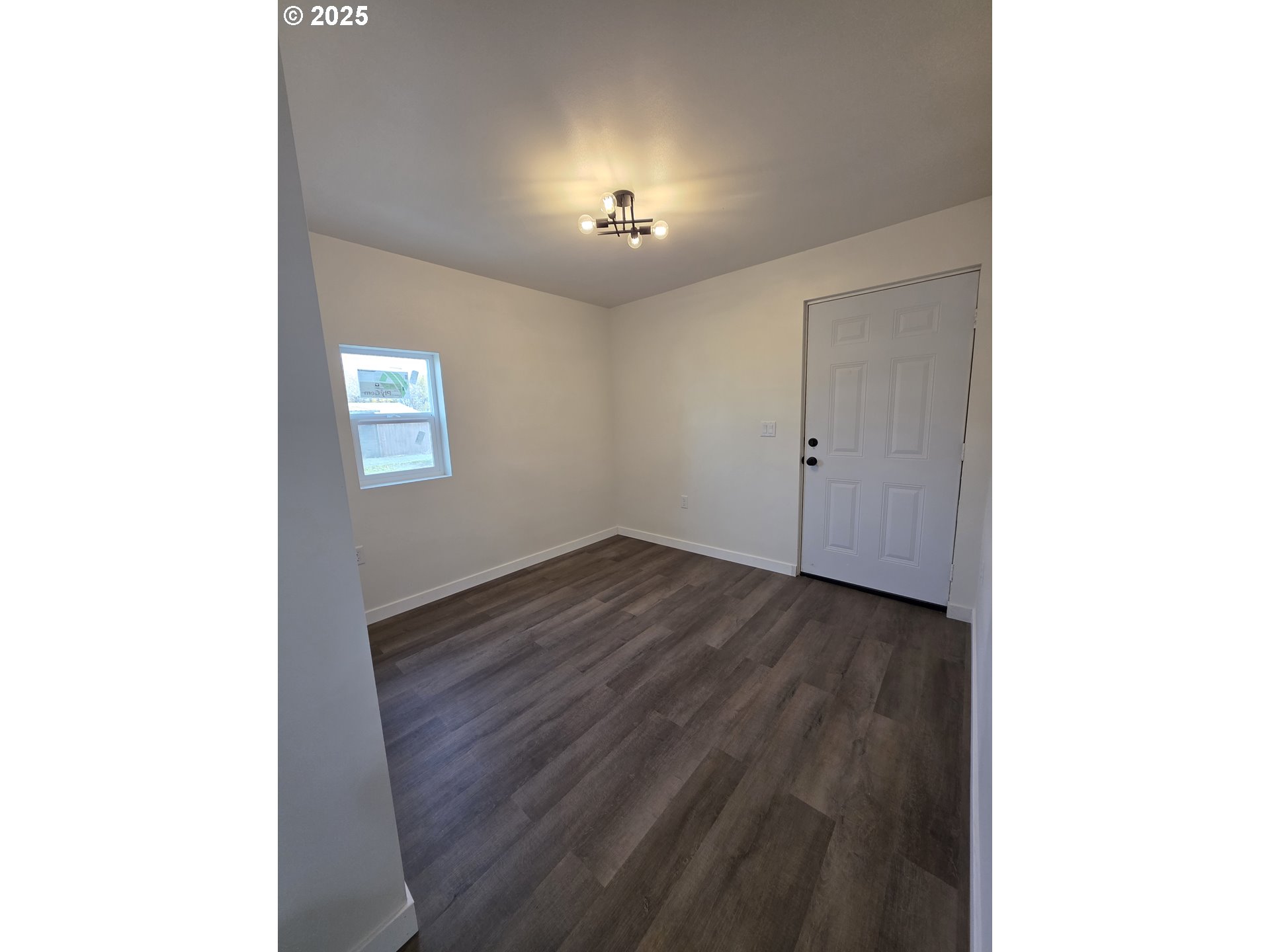 310 4th Street Northeast Irrigon, OR 97844 - Photo 8 of 13 a view of a livingroom with hardwood floor and hallway