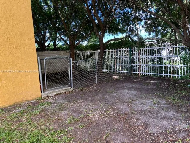 a view of backyard with green space