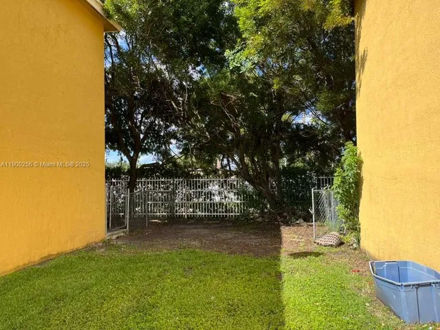 a view of yard with swimming pool