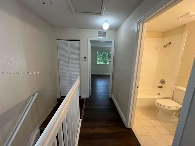 a view of a bathroom from the hallway