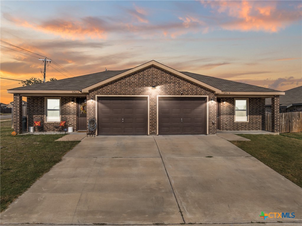 5701 Rustler Drive, Unit B Killeen, TX 76543 - Photo 1 of 29 front view of a house with a yard