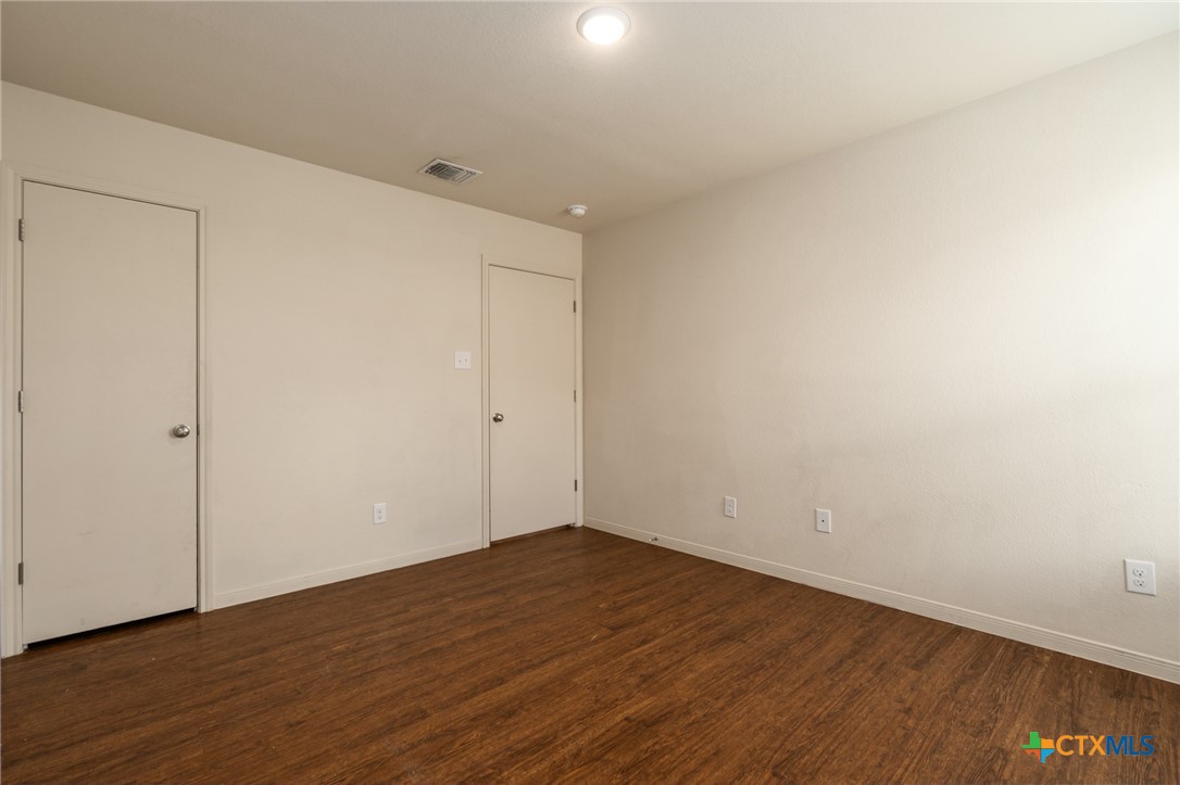 5701 Rustler Drive, Unit B Killeen, TX 76543 - Photo 13 of 29 a view of an empty room with wooden floor