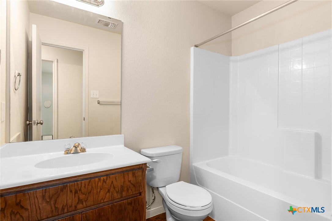 5701 Rustler Drive, Unit B Killeen, TX 76543 - Photo 17 of 29 a bathroom with a sink a toilet and a bathtub