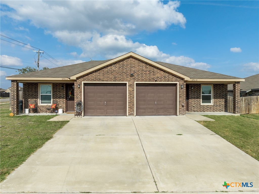 5701 Rustler Drive, Unit B Killeen, TX 76543 - Photo 2 of 29 front view of a house with a garden
