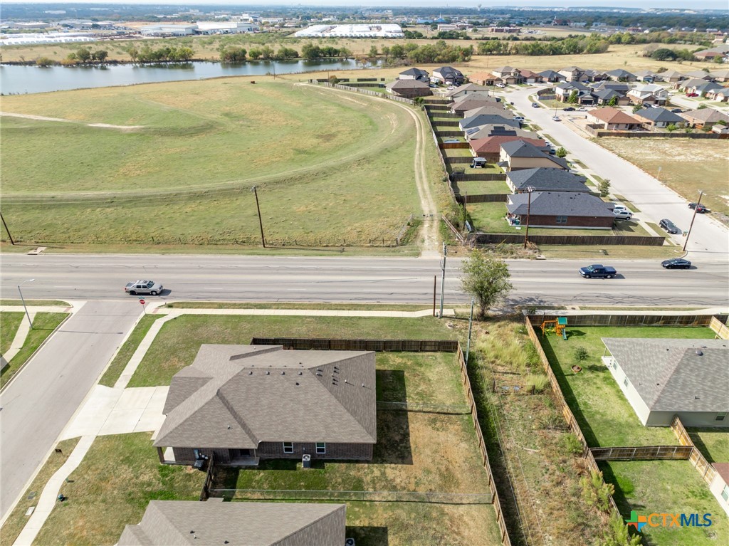 5701 Rustler Drive, Unit B Killeen, TX 76543 - Photo 27 of 29 a view of a swimming pool with a lawn chairs
