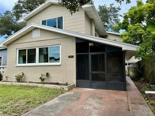 a house with trees in the background