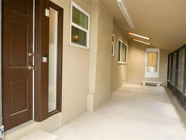 a view of a hallway with windows