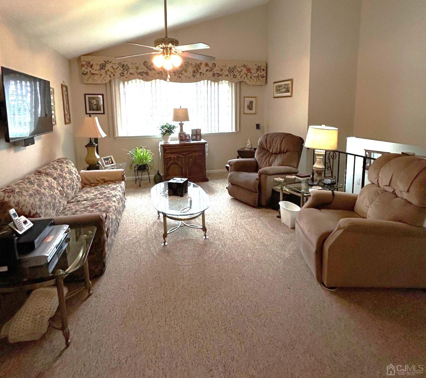 327 New Market Road Dunellen, NJ 08812 - Photo 5 of 13 a living room with furniture and a chandelier