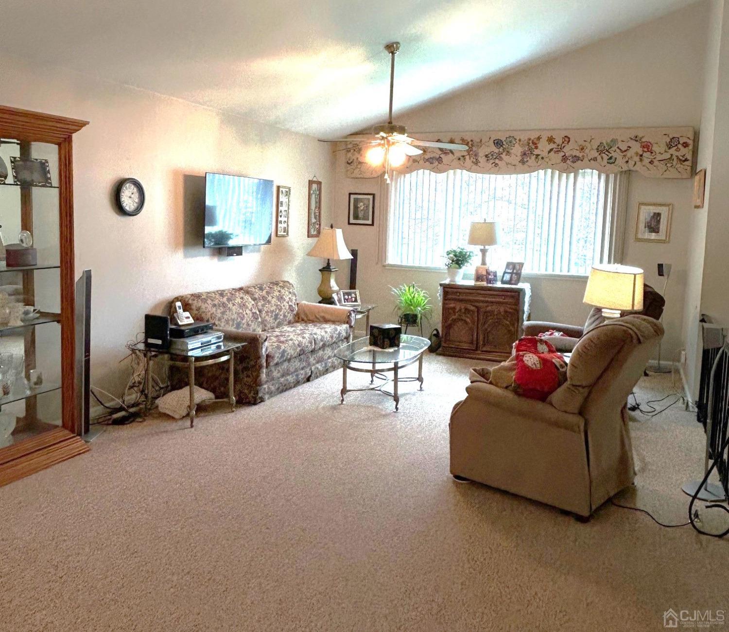 327 New Market Road Dunellen, NJ 08812 - Photo 6 of 13 a living room with furniture and a chandelier