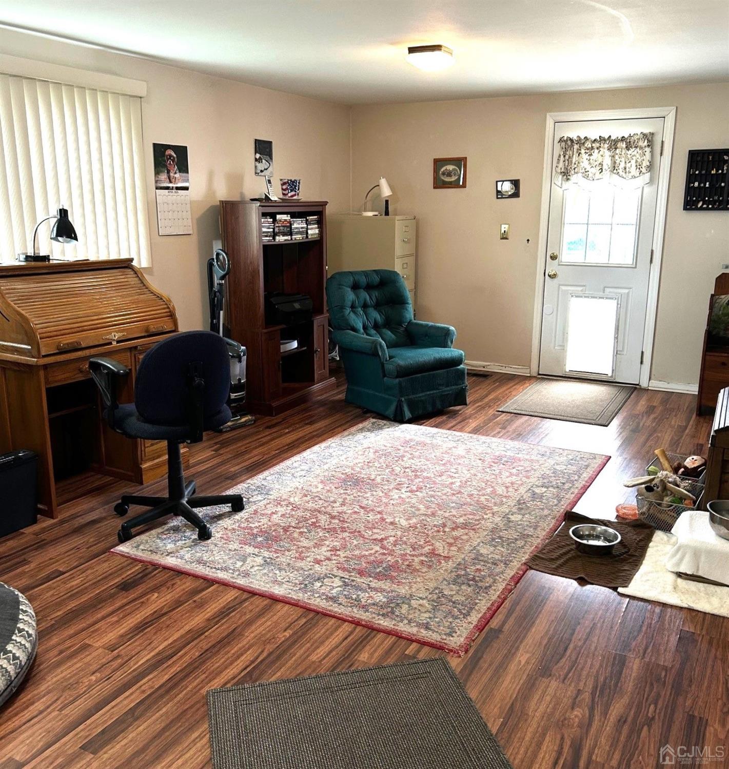 327 New Market Road Dunellen, NJ 08812 - Photo 9 of 13 a living room with furniture and a wooden floor
