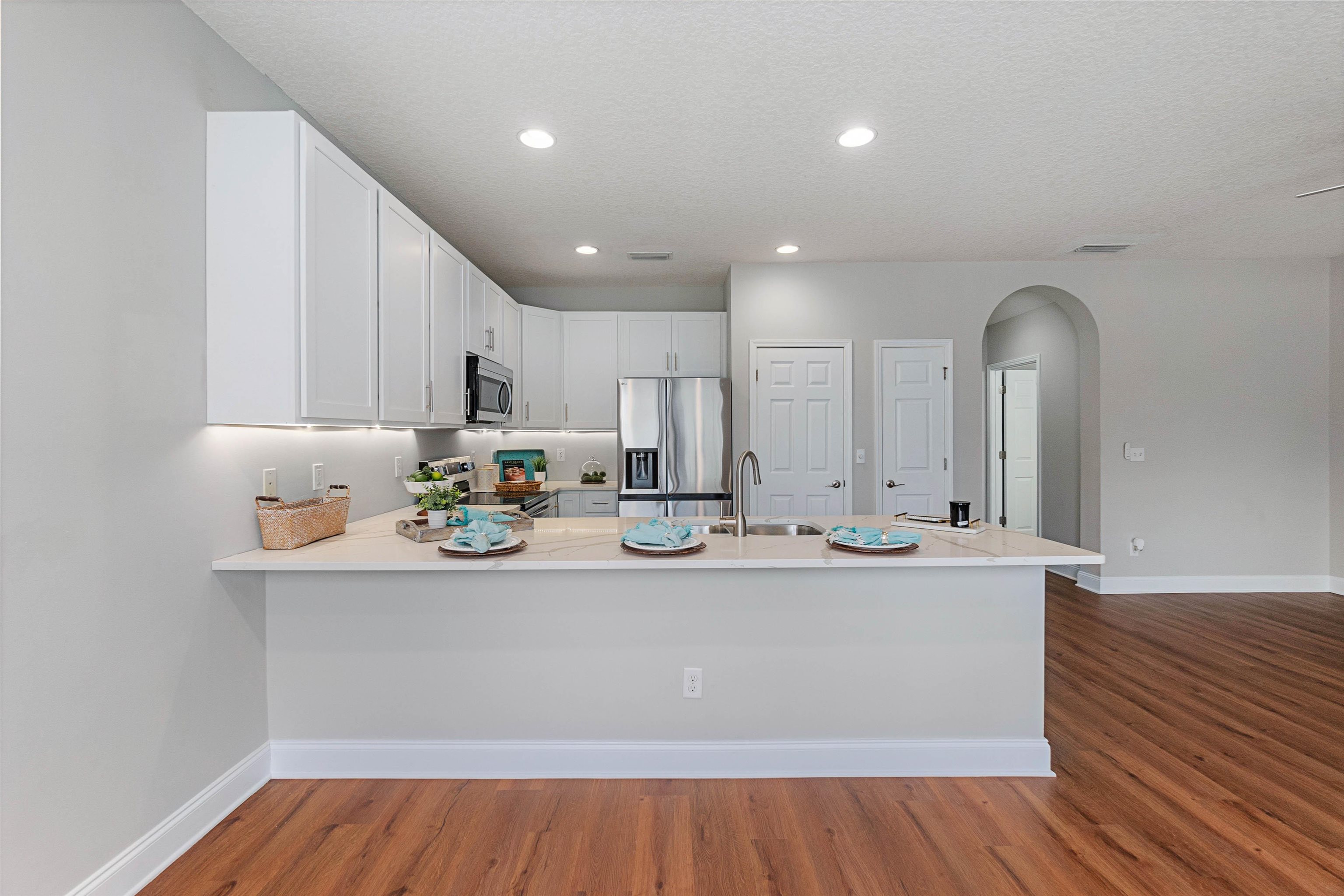 18 Amistad Drive St. Augustine, FL 32086 - Photo 11 of 37 a view of kitchen with stainless steel appliances granite countertop a sink and dishwasher with wooden floor