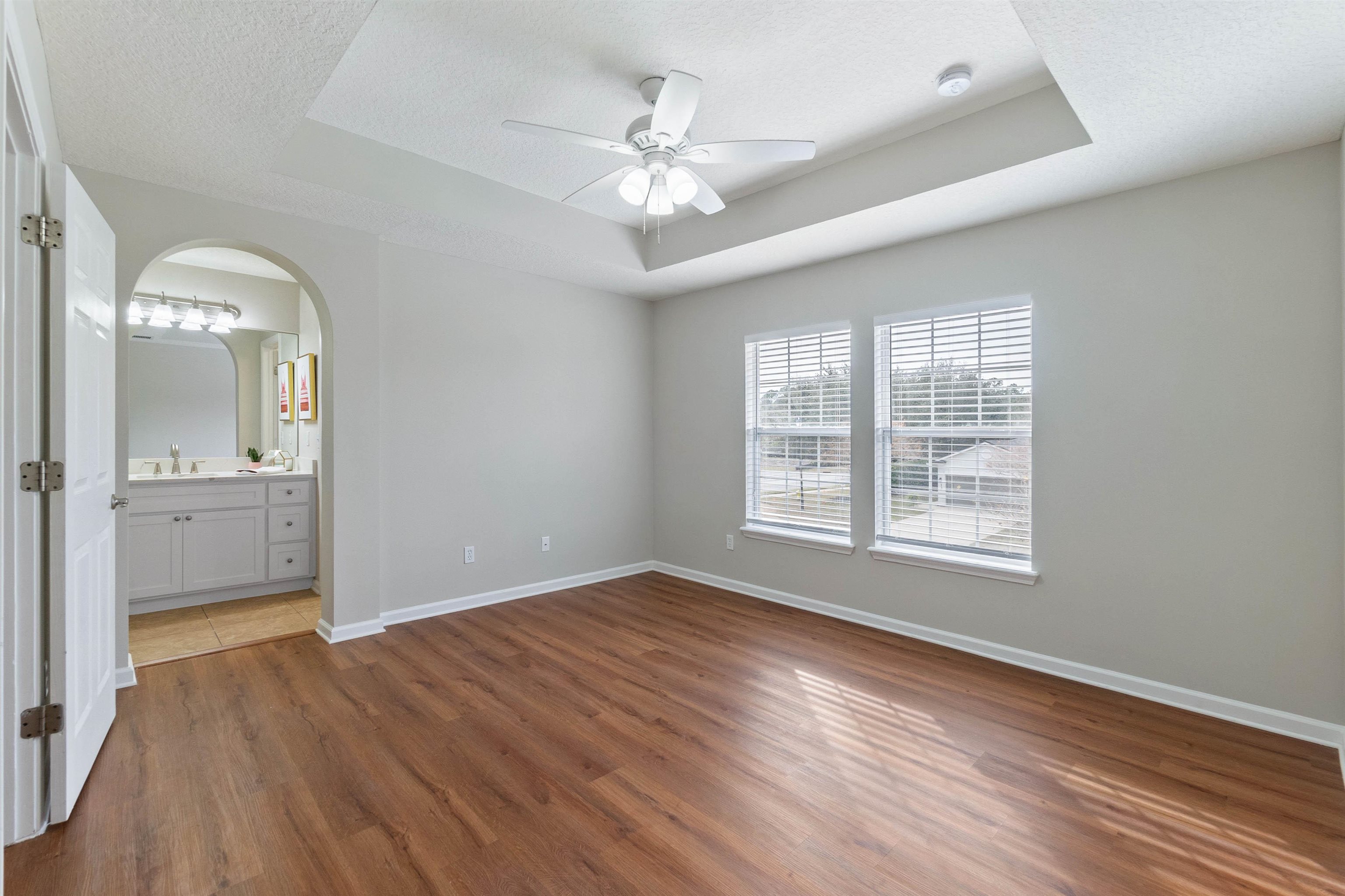18 Amistad Drive St. Augustine, FL 32086 - Photo 16 of 37 wooden floor in an empty room with a window