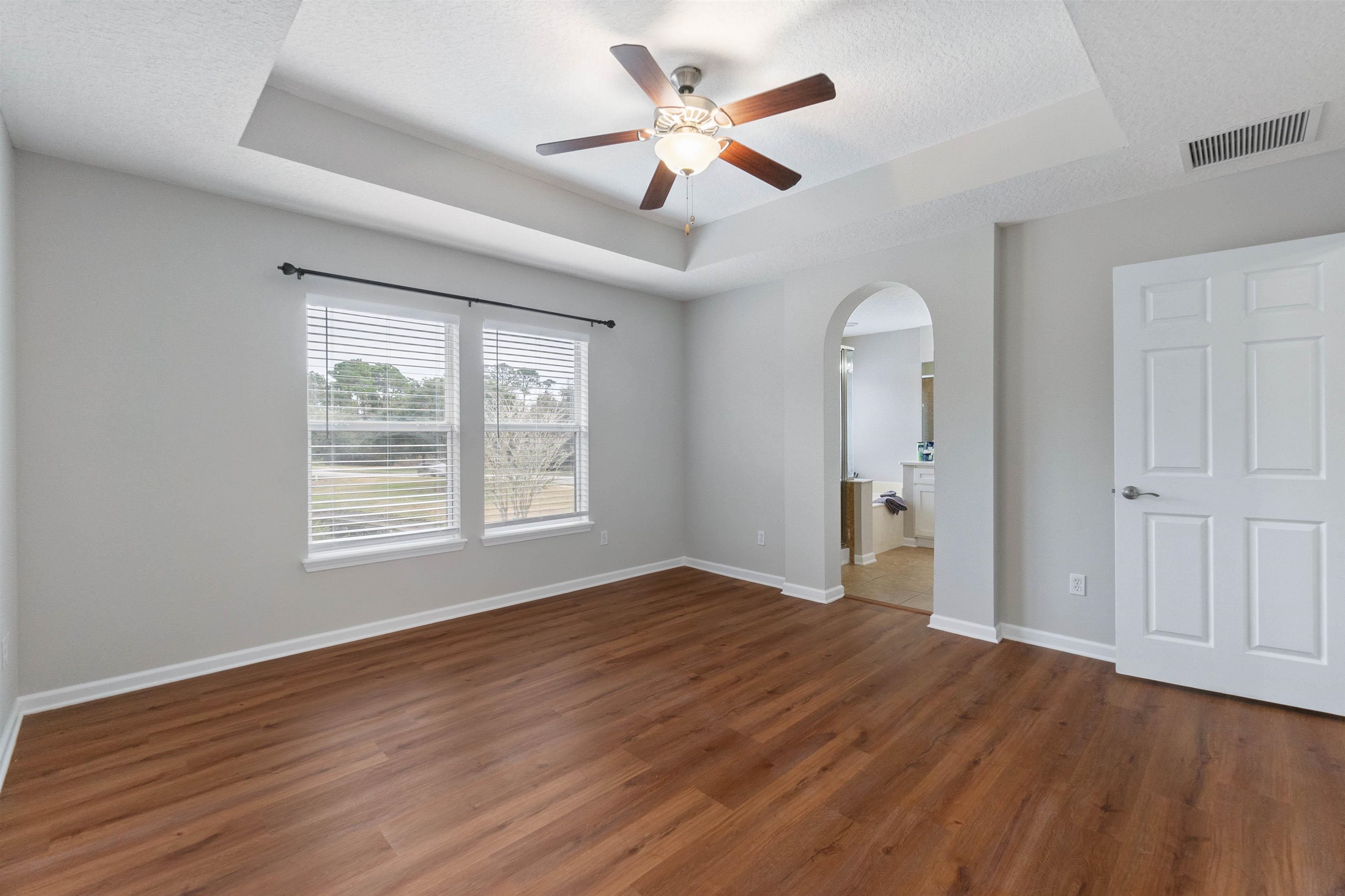 18 Amistad Drive St. Augustine, FL 32086 - Photo 21 of 37 a view of an empty room with a window and wooden floor